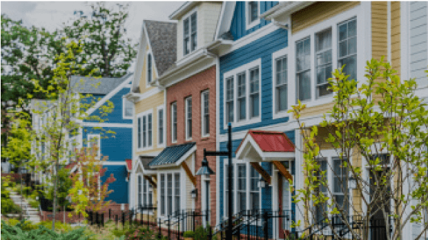 A screen shot of the front view of a row of different colored homes
