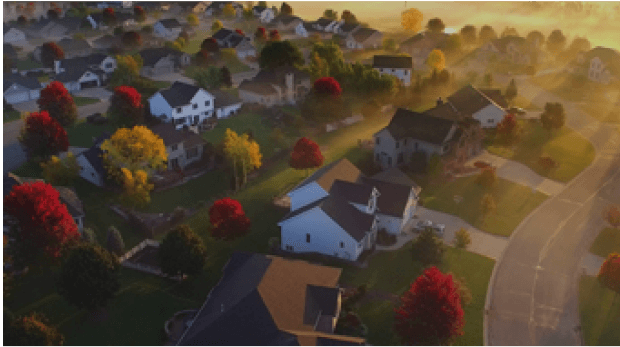 A screenshot of a suburban neighborhood during sunrise